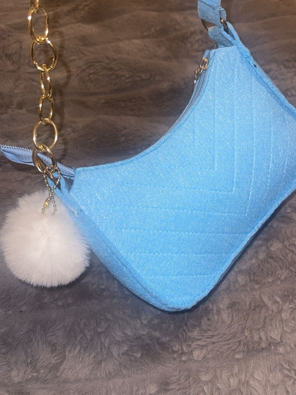 Sky Blue Quilted Shoulder Bag with Gold Chain and Pom Pom Charm